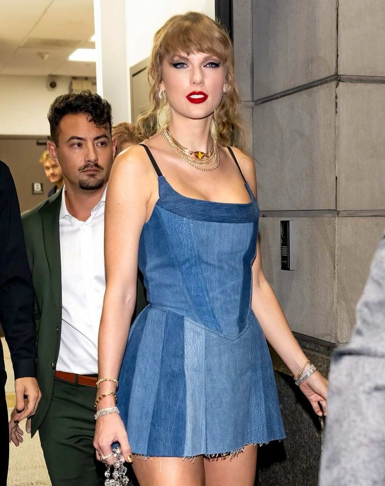 Taylor Swift in the blue version of the EB Denim dress in 2023