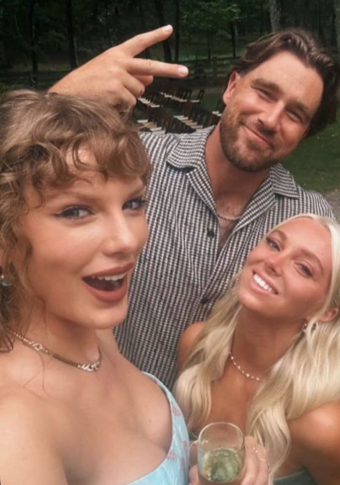 Taylor Swift and Travis Kelce take a selfie with a blonde woman