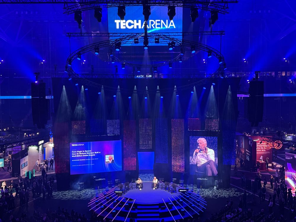 Sir Richard Branson is interviewed on a stage by a journalist at Techarena in Stockholm. 