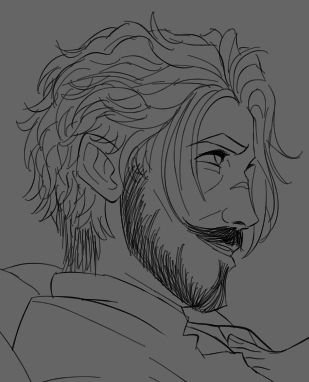 Side profile of Carver looking up at someone off camera. His hair is messy and unkempt and he's smirking past a groomed mustache and a short boxed beard. He's smooshed up against a pillow by a feminine foot on his chest.