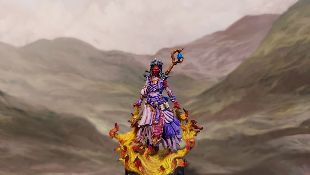 Tiefling sorcerer conjuring an inferno (acquired from etsy, unsure of the sculptor)