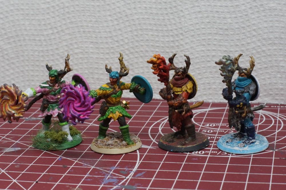 Four versions of an Eladrin Druid: Spring, Summer, Fall, and Winter