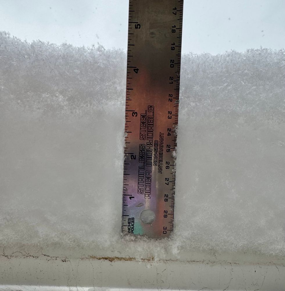 Photo of accumulated snowfall on my balcony. I have held up a ruler showing ~4.5 in of snow