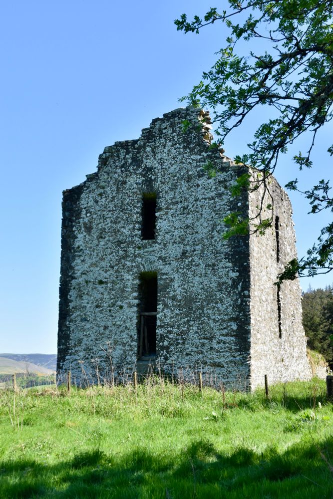 Ruin, with two sides mostly intact, but no roof. Two narrow windows