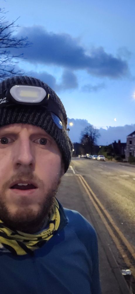 Runner wearing a beanie with an unilluminated head torch 