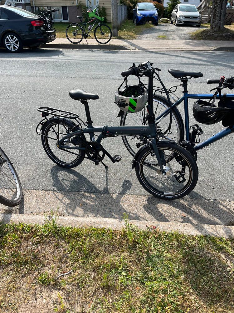 Photo of a Tern adjustable bike with helmet hanging off the handlebars