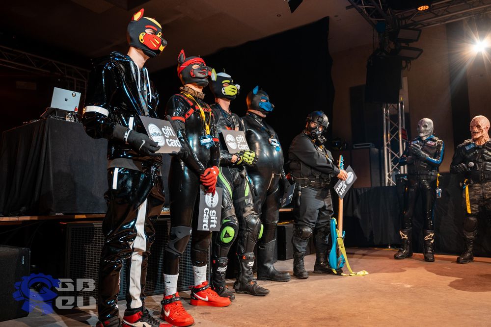 The guy from the first two pictures in a row with other guys wearing puppy masks.