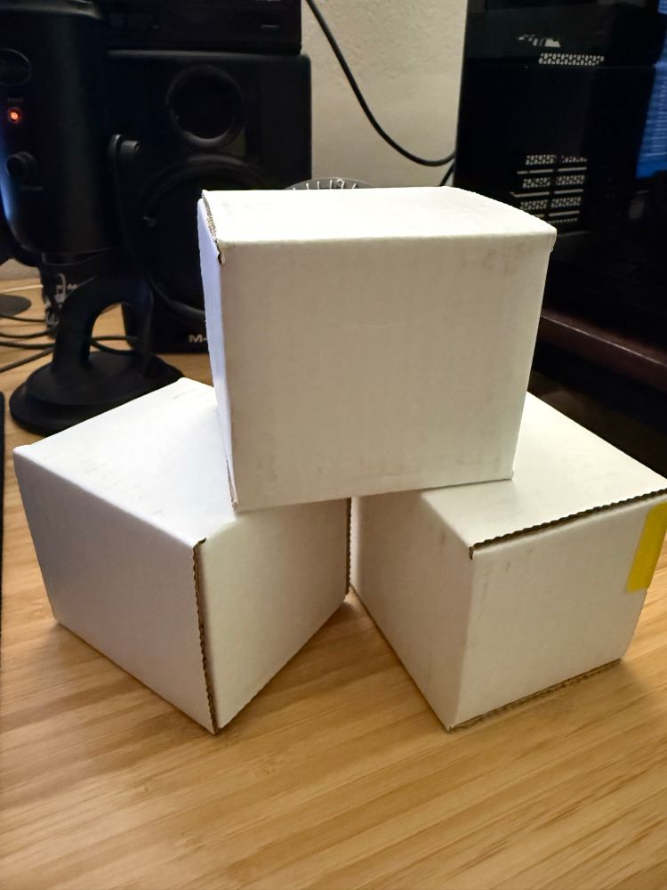 3 white cube boxes