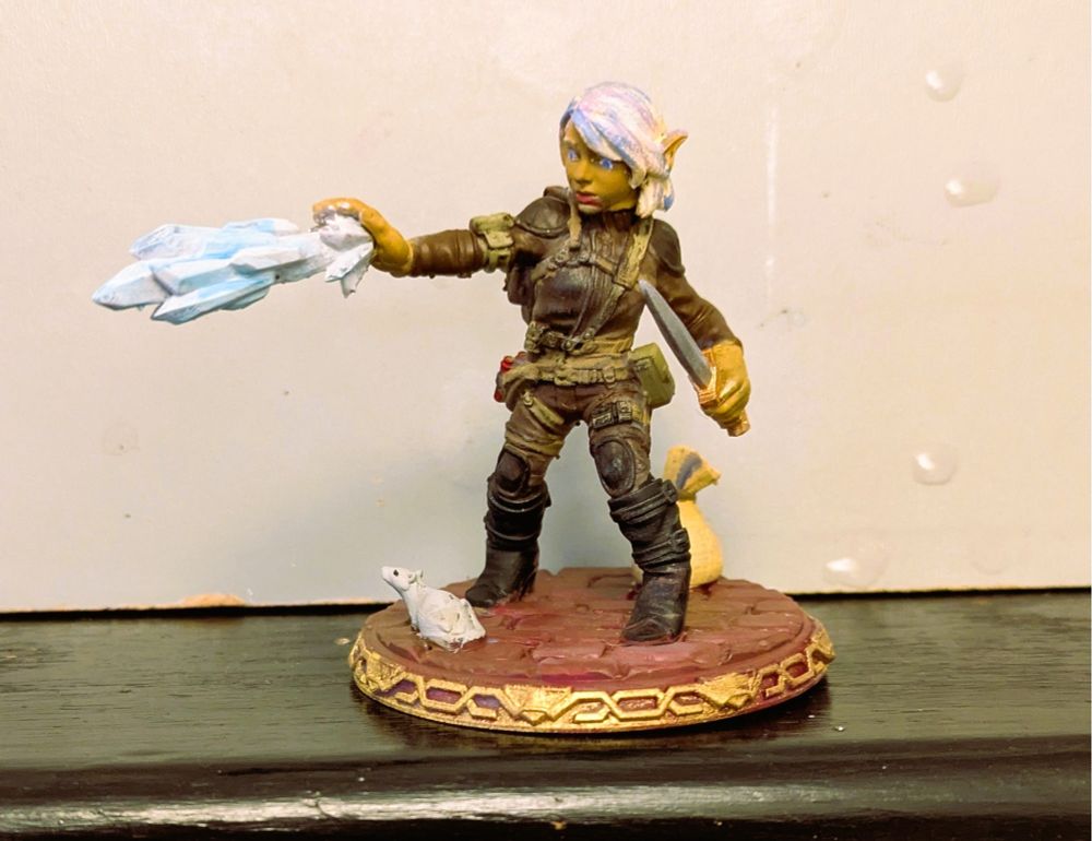 A miniature Gnome Arcane Trickster casting ray of frost