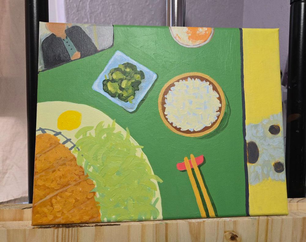 Acrylic painting of a tabletop scene. Looking down, there is a cell phone playing a video, a meal including tonkatsu, rice, pickles and a beer. There is a small dog looking up from the side of the table.