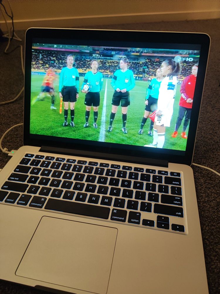 Laptop with a football match