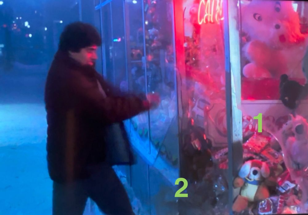 Billy smashes through window pane 2, instead of pane 1 where a gremlin already broke through