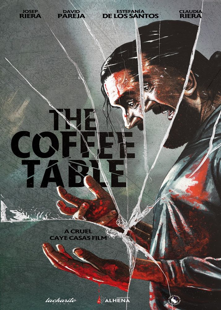 Poster for THE COFFEE TABLE (2023). The title is in the middle and to the left in black font. The entire poster is made to look like broken glass, behind which we can see the fractured image of a man covered in blood and looking utterly traumatised. The tagline reads “A cruel Caye Casas film”.