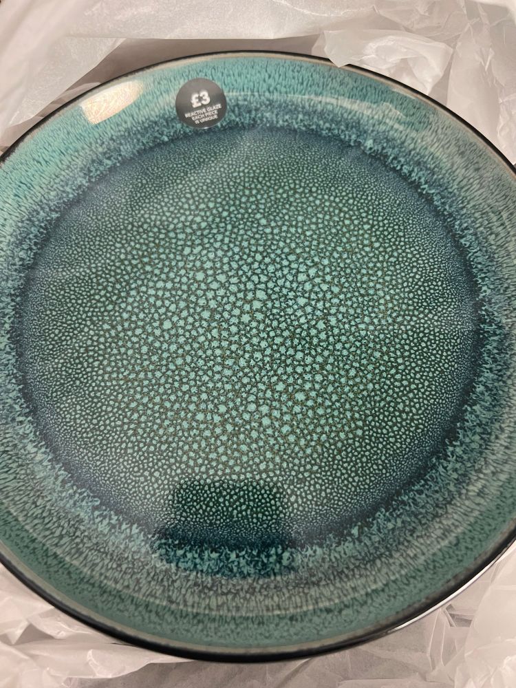 My new plates! They are green and black and the sticker on them says ‘£3 Reactive Glaze Each Piece is Unique’