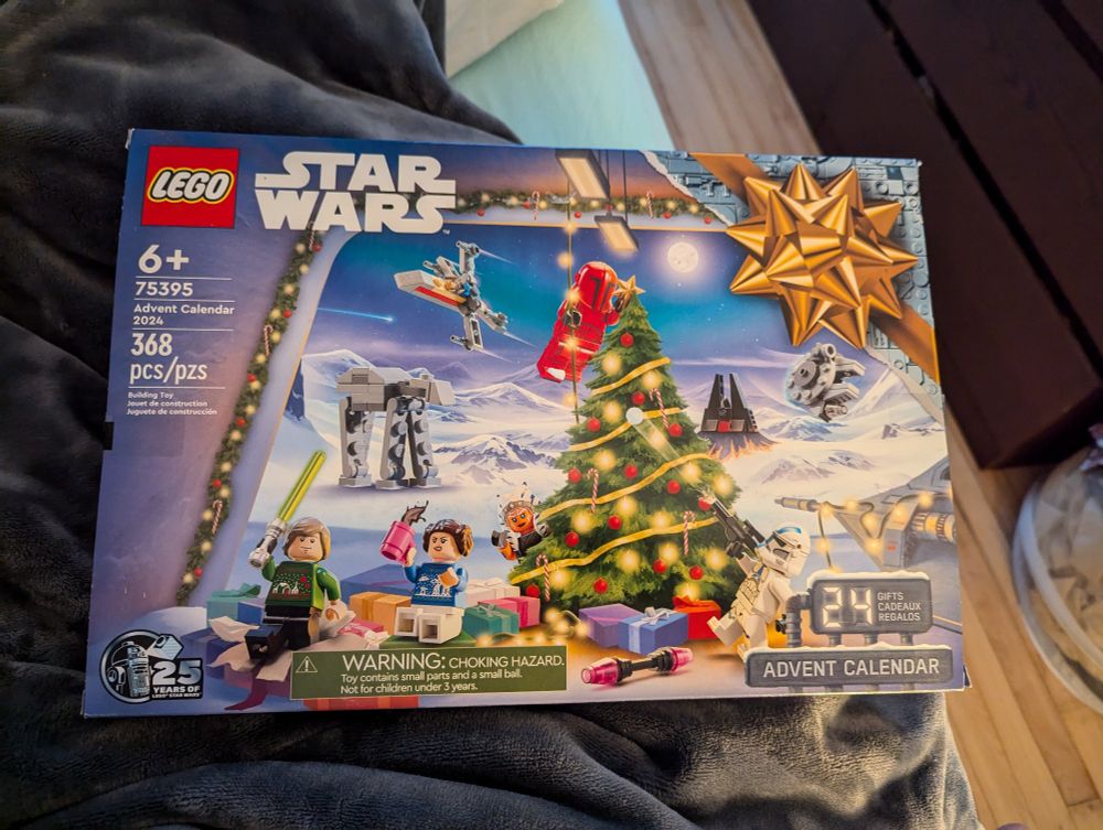 A Star Wars Advent calendar. The Luke and Leia minifigs have star wars themed ugly Christmas sweaters.