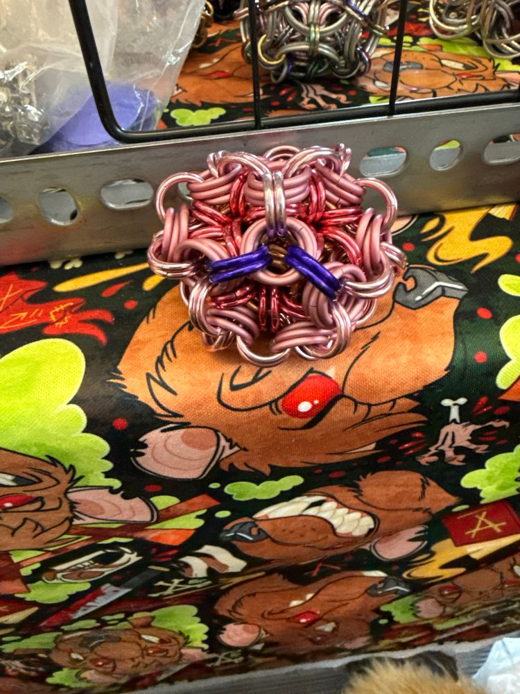 Chainmaille juggling ball in pink shades and purple