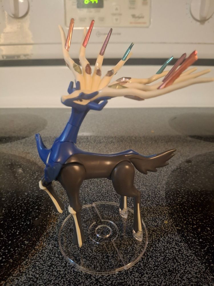 Xerneas model put together and sitting on a stove top