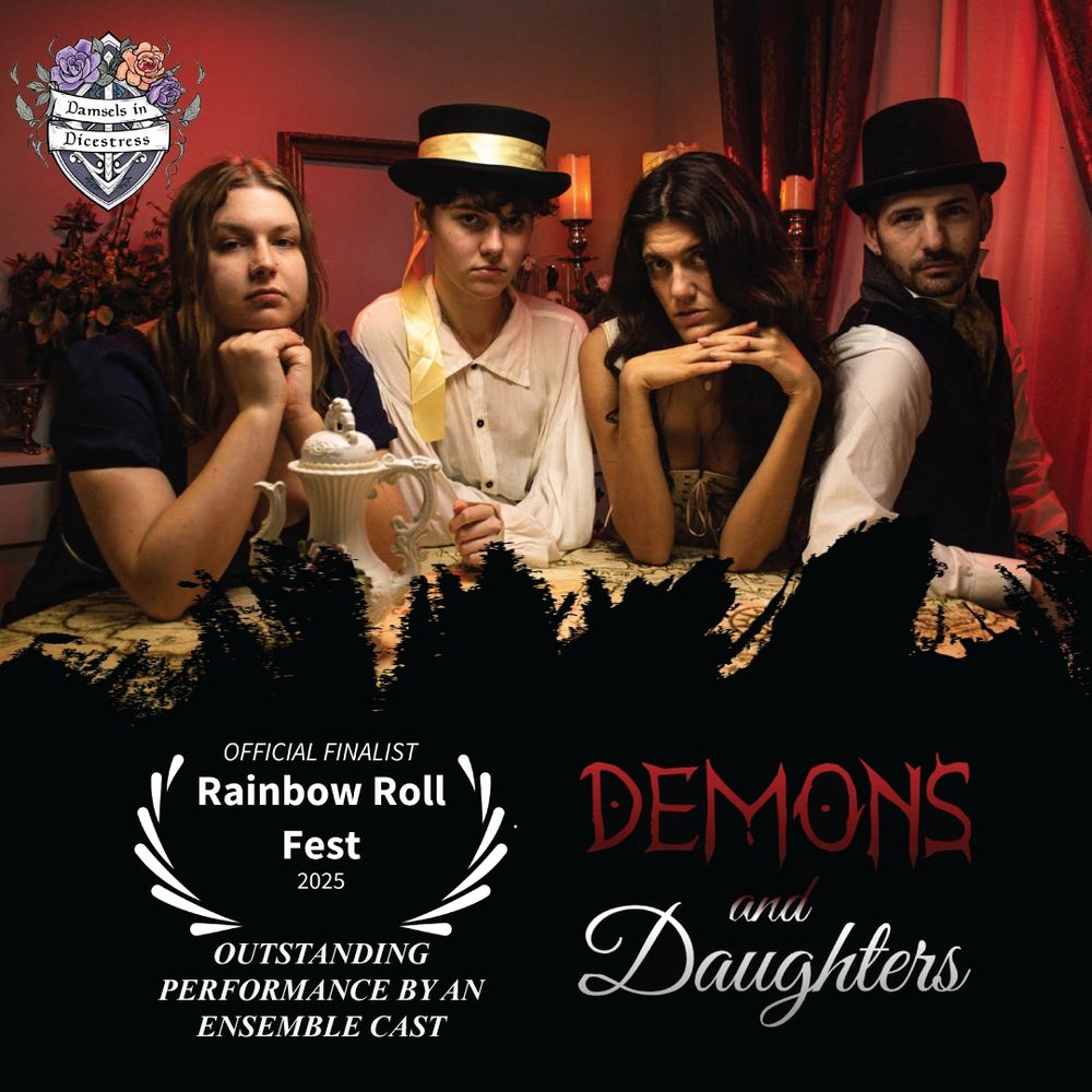 The cast of Demons and Daughters in Regency attire sat around a table in red lighting. A candelabra and dried flowers in he background. Laurels for Outstanding Performance by an Ensemble Cast beside the logo along the bottom.