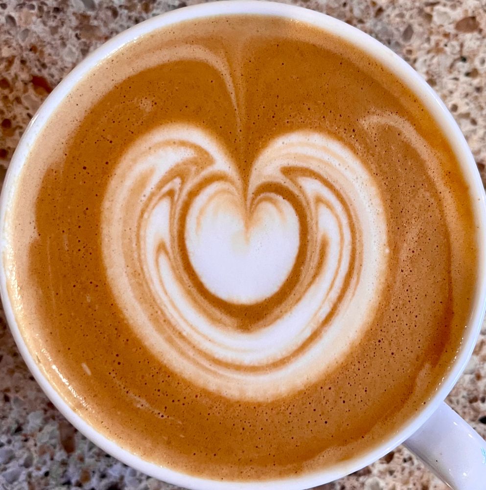 Double wrapped heart latte art that’s actually centered in the cup. 