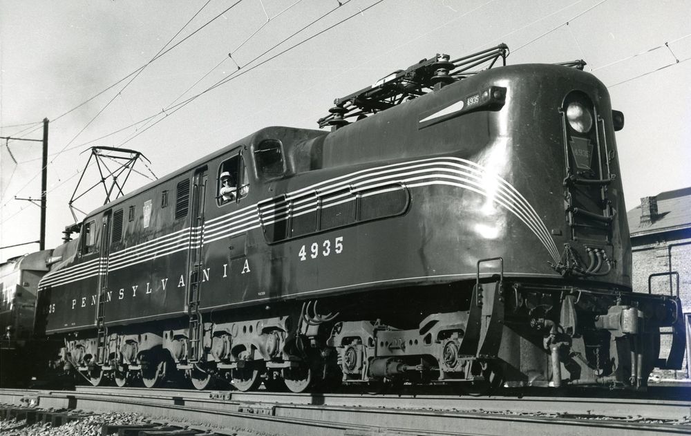 black and white photo of a pennsylvania railroad streamlined gg1 electric locomotive 