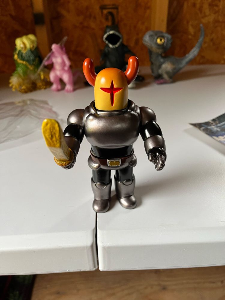 A vinyl toy of a knight with a sword