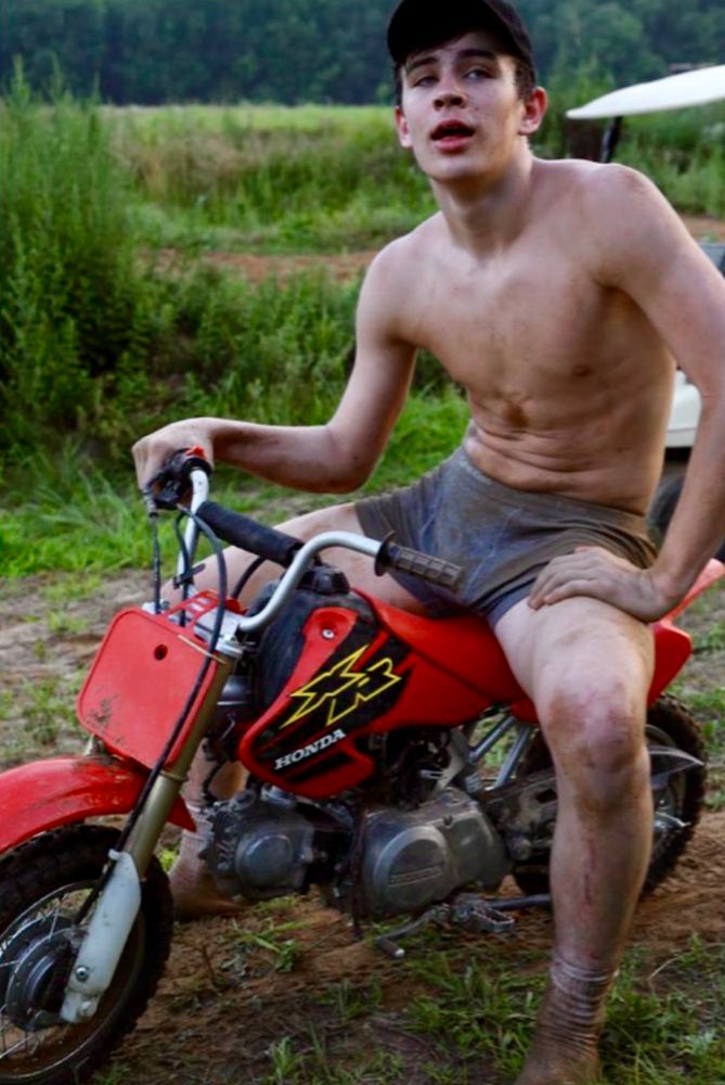 Hot guy on a small motorcycle. He’s only wearing his underwear. He’s also muddy. 