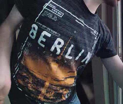 Cropped picture of a young man wearing a tshirt saying Berlin. 
