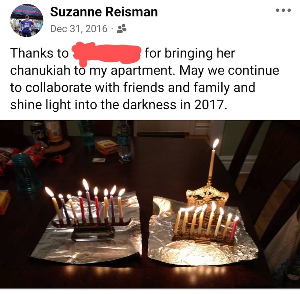 Facebook memory from 2016 thanking my friend for bringing her chanukiah over for NYE. Two chanukiot are pictured, each with all candles lit, with foil under them