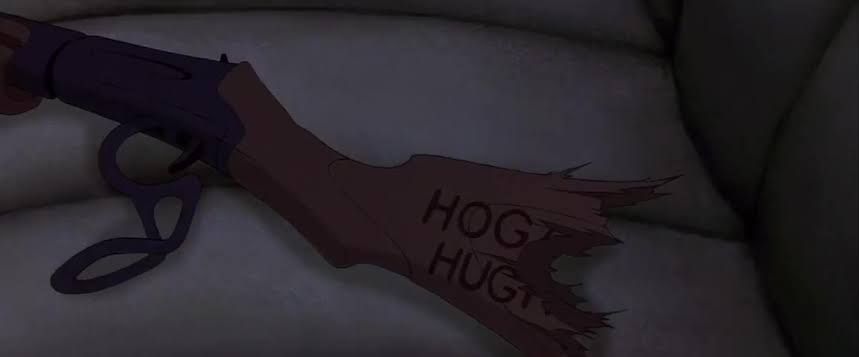 a frame from the iron giant, showing a bb gun that reads "hog hug"