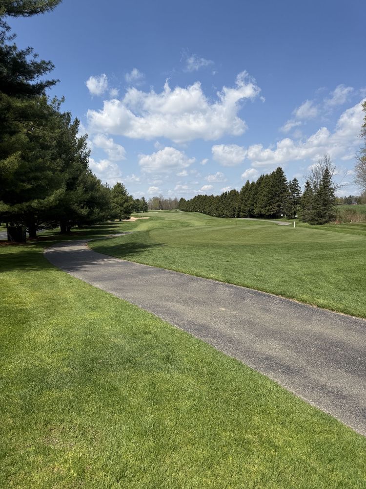 Picture of first hole of a golf course from the tee. 