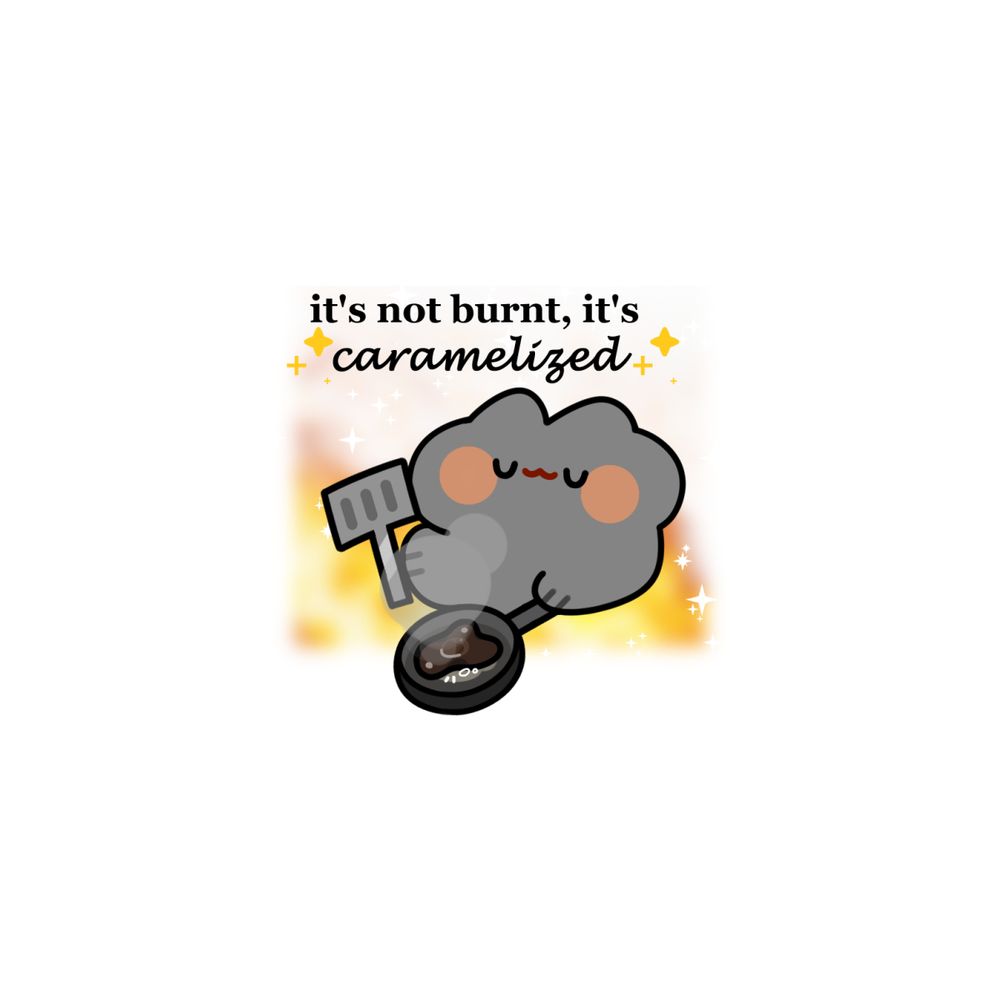 a grey cat holding a frying pan and spatula with fire burning in the background, there is a blacken egg in the pan, smoking. the text says 'it's not burnt, it's caramelized(script font)'