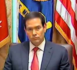 Screenshot of Marco Rubio from the video with dead eyes and a blank look