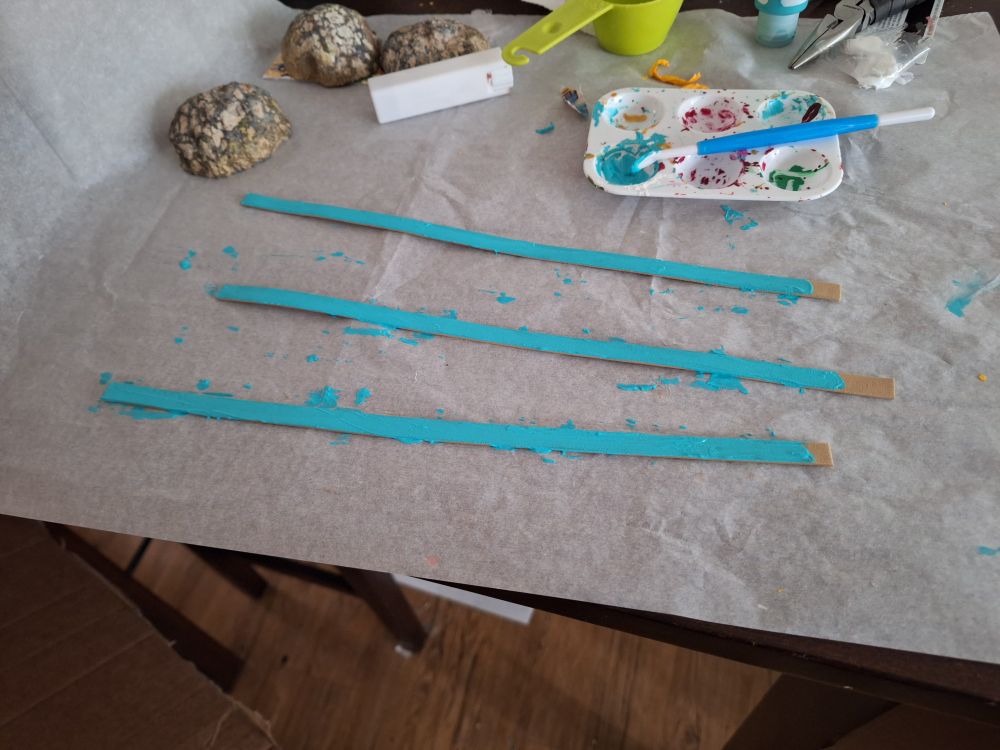 Foam strips being painted blue
