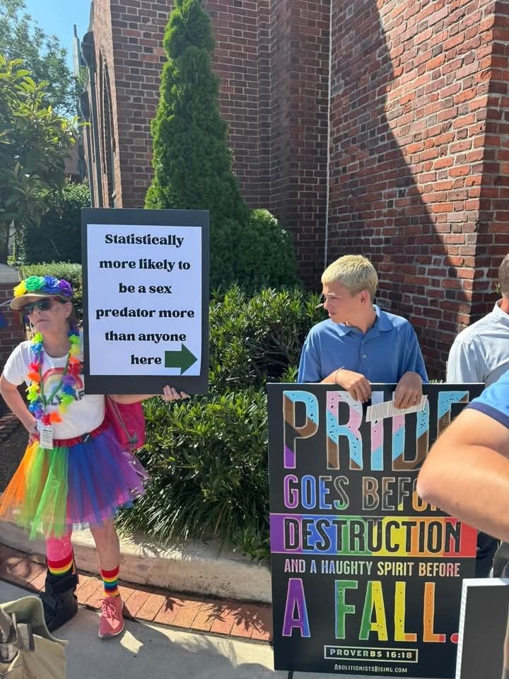 Christian anti pride protester holding sign that says "pride goes before destruction and a haughty spirit before a fall (proverbs 16:18)

Beside them is a queer person holding a sign that points to them with a green arrow and says "statistically more likely to be a sex predator more than anyone here