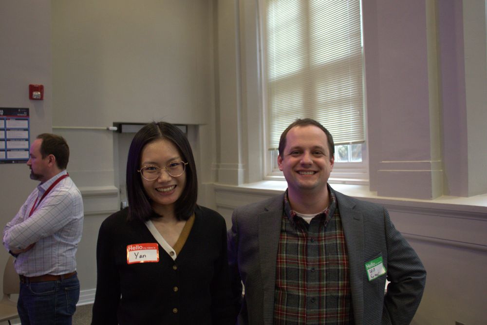 Yan Chen and Will Conner smiling at the event.