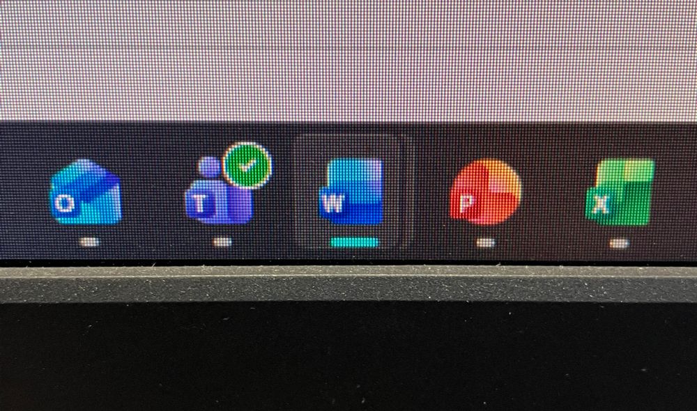 Close up of windows task bar showing the new icons for outlook, teams, word, PowerPoint and excel. They look similar to the previous icons, but with curved corners and gradients that make them look shiny and wet. Objectively I suppose they look quite nice but autistically I have to say the change is not worth it. I don’t want my programs to be wet please and thank. That would break the computer.