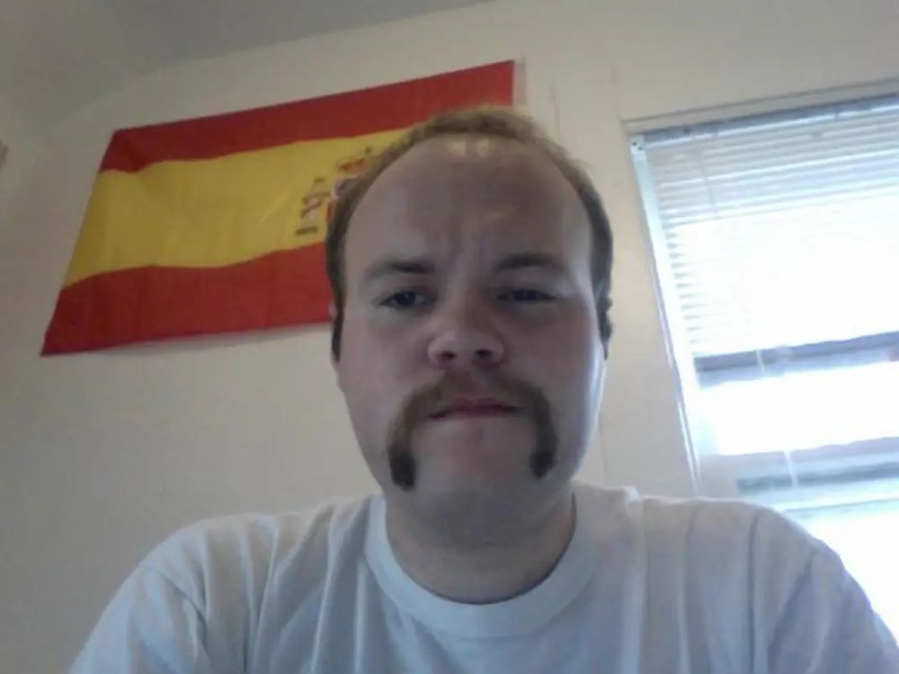 A sad, mustachioed me circa 2015(?)