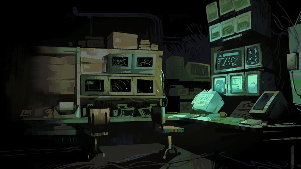 A room full of monitors and devices above an L shaped desk, its dark except for light emitted by a wall of monitors to the right.