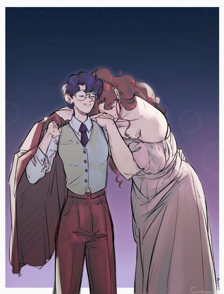 Picture of Makoto and Ami standing in a loving casual embrace. Makoto heavily leaning on Ami while Ami has one hand on the other woman’s hips. Ami dressed in a fancy burgundy suit while Mako is wearing a light pink sleeveless dress.