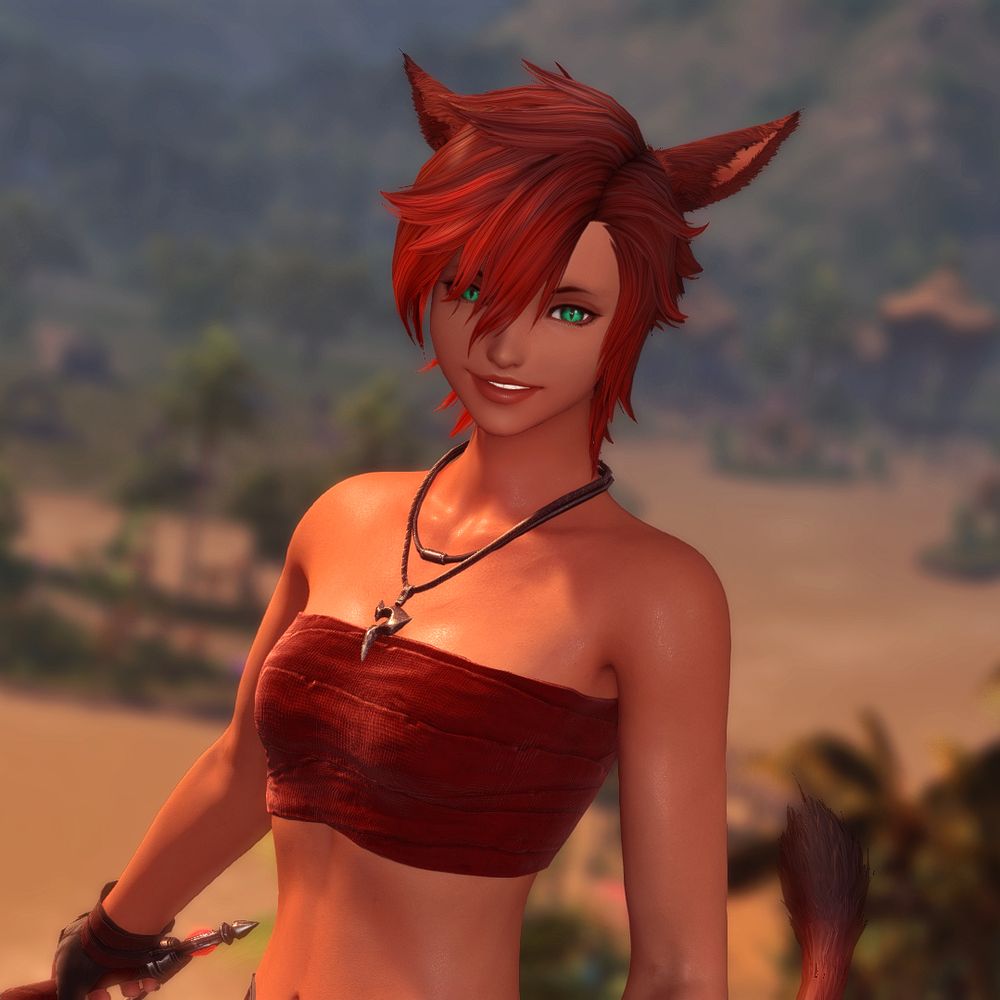 Lomasi, a redhead cat girl with lightly tanned skin smiling at the camera