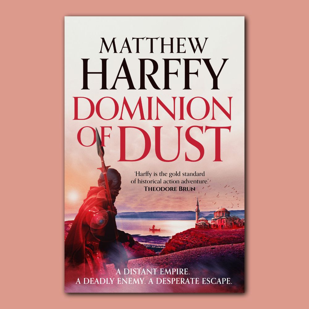 DOMINION OF DUST
Book cover of Dominion of Dust by Matthew Harffy. The image shows a warrior in a red cloak holding a spear, standing on a rocky shore at sunset. In the background, a domed building and minaret rise against a dramatic sky, with a Viking ship on calm waters. Bold title text reads: Dominion of Dust, with the tagline below: “A distant empire. A deadly enemy. A desperate escape.”