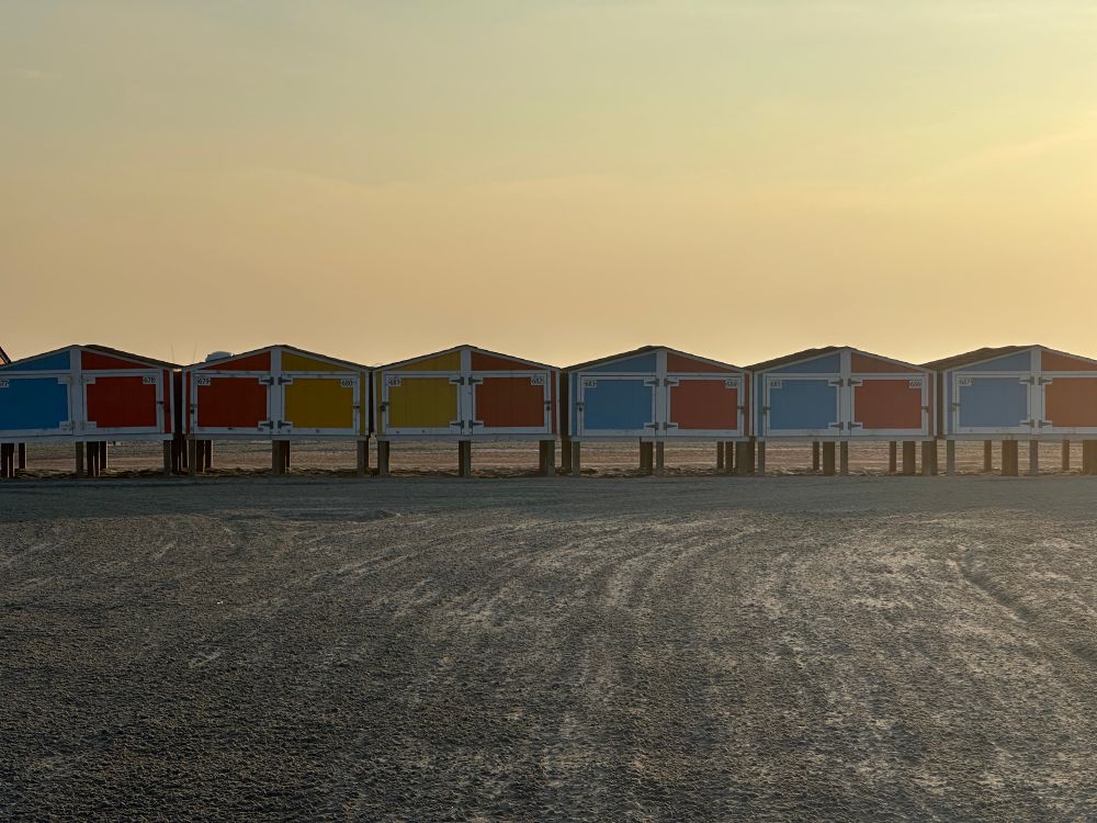 A photo of beach lockers at sunrise