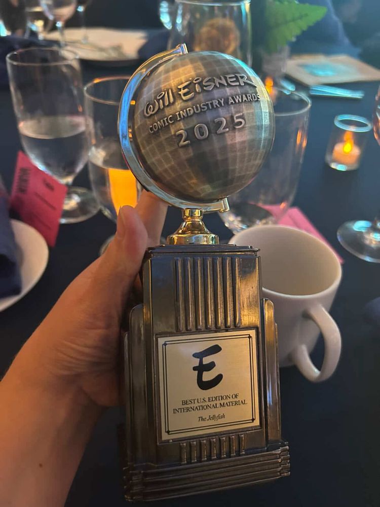 A photo of an Eisner Award, it says “The Jellyfish” on it at the bottom!!