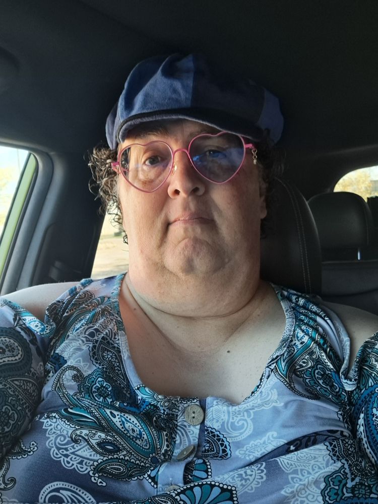 A trans gal, dressed up for a failed attempt at getting a state ID, feeling as blue as the clothes she's wearing