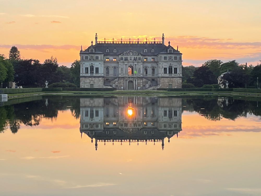 Sun setting through the windows of the château in the park
