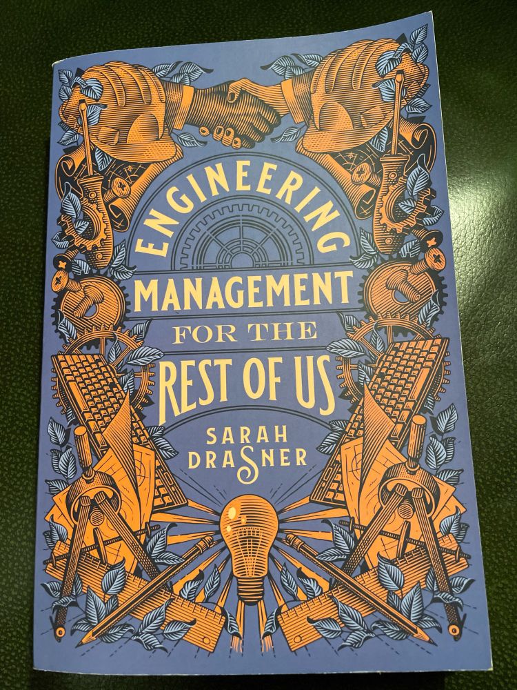 Beautiful gold and blue cover with keyboards, hard hats and tools of „engineering management for the rest of us“