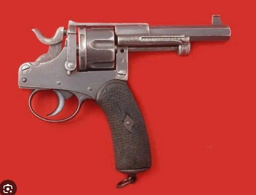 An old revolver where the barrel is pointed back at the user. Not sure why it exists, or if it's even a real photo
