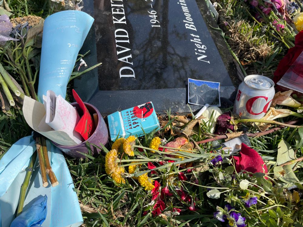 A can of Diet Coke, more cigarettes, a sticker for Twin Peaks, and some notes left for David Lynch