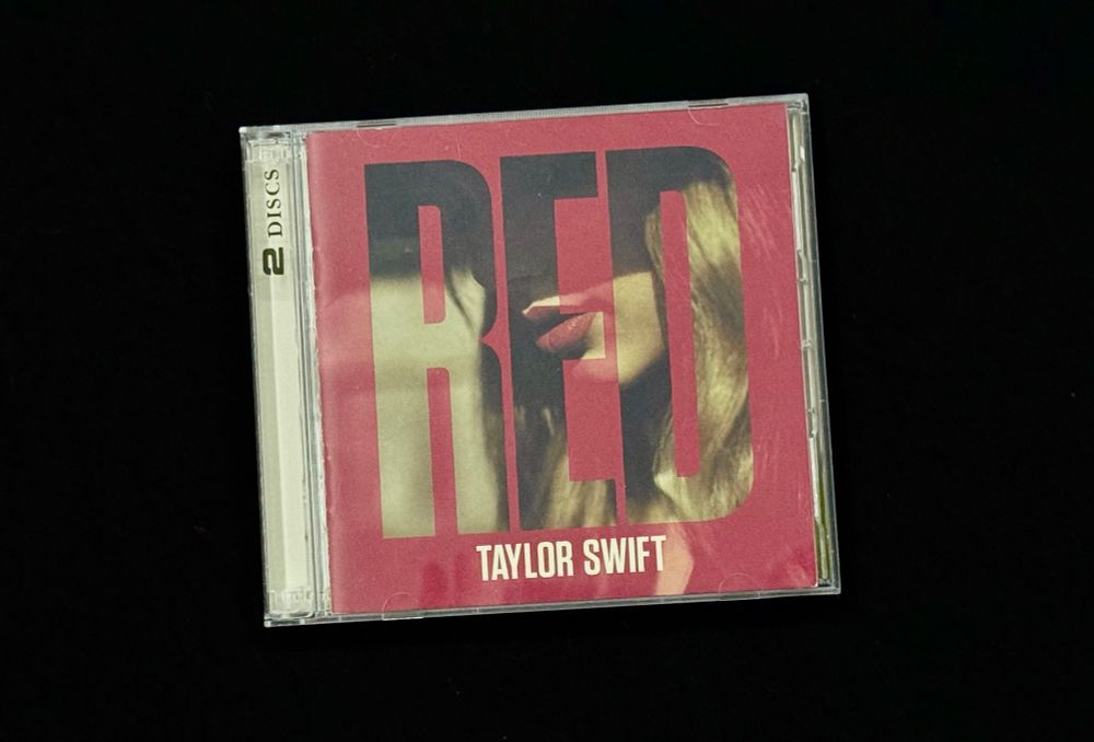 A physical deluxe CD for Red by Taylor Swift