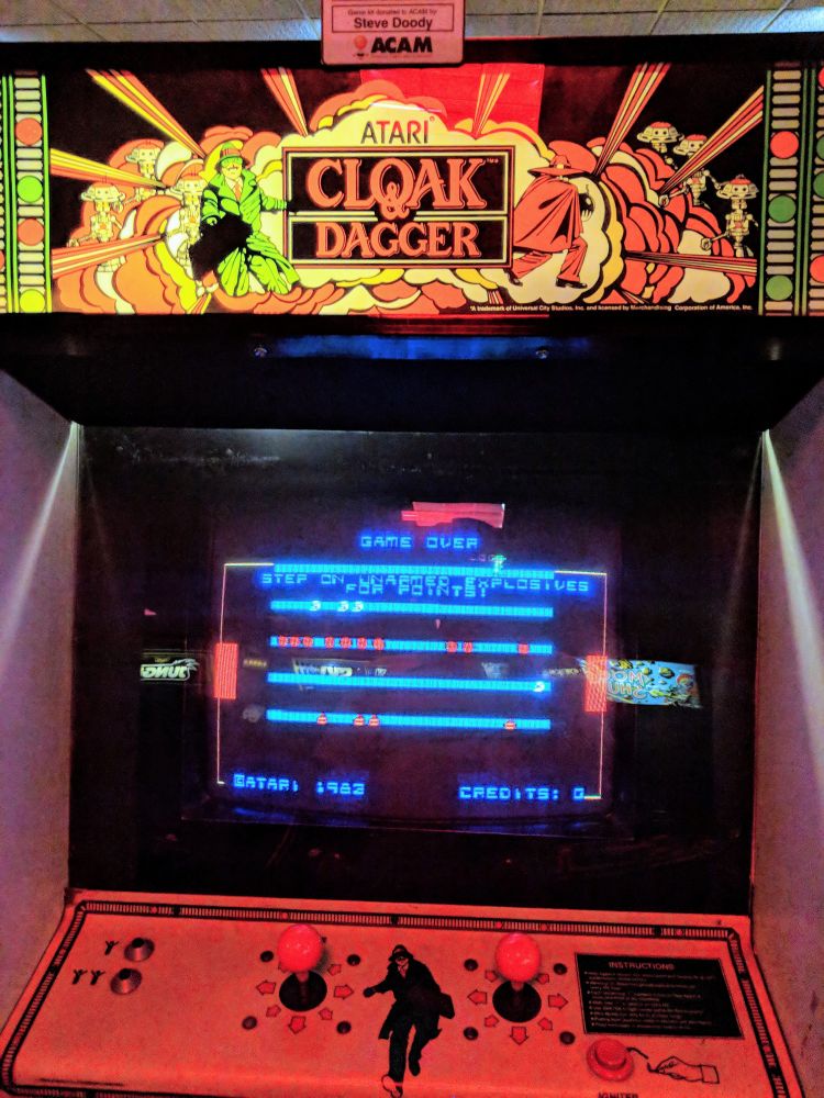 A cloak and dagger arcade cabinet.